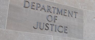 closeu[ image of the U.S. Department of Justice written on the side of a building