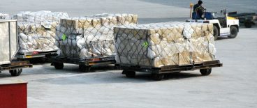 image of pallates of boxes at airport ready to be shipped