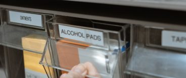 Medical supplies in labeled cabinet drawers