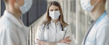 three healthcare workers in hallway