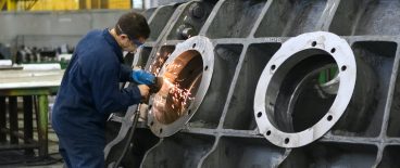 Worker working on fixing portholes
