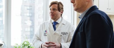 doctor and male patient talking in office