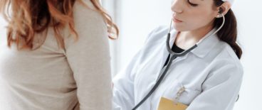 doctor giving patient a check-up