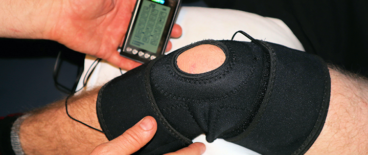 doctor checking on patients knee