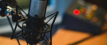 microphone in foreground against blurry desk background