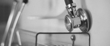 close up photo of stethoscope hanging on wall