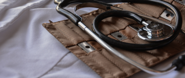 stethoscope on top of a doctor's white coat