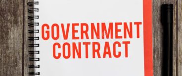 Government contractor written on a notepad with markers on the side