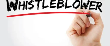 person underlining word whistleblower with red pen