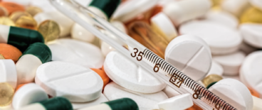 A thermometer and pills