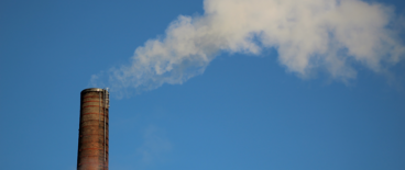 a large chimney emitting smoke