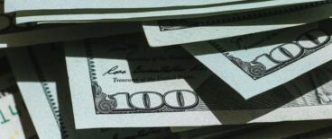 scattered hundred dollar bills