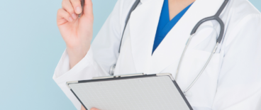 doctor with a notepad and a pen