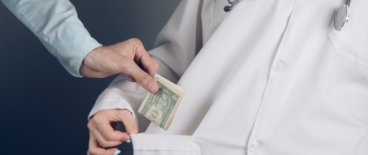 a doctor accepting bribe