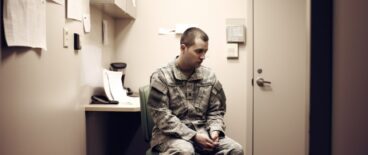 soldier siting in a room